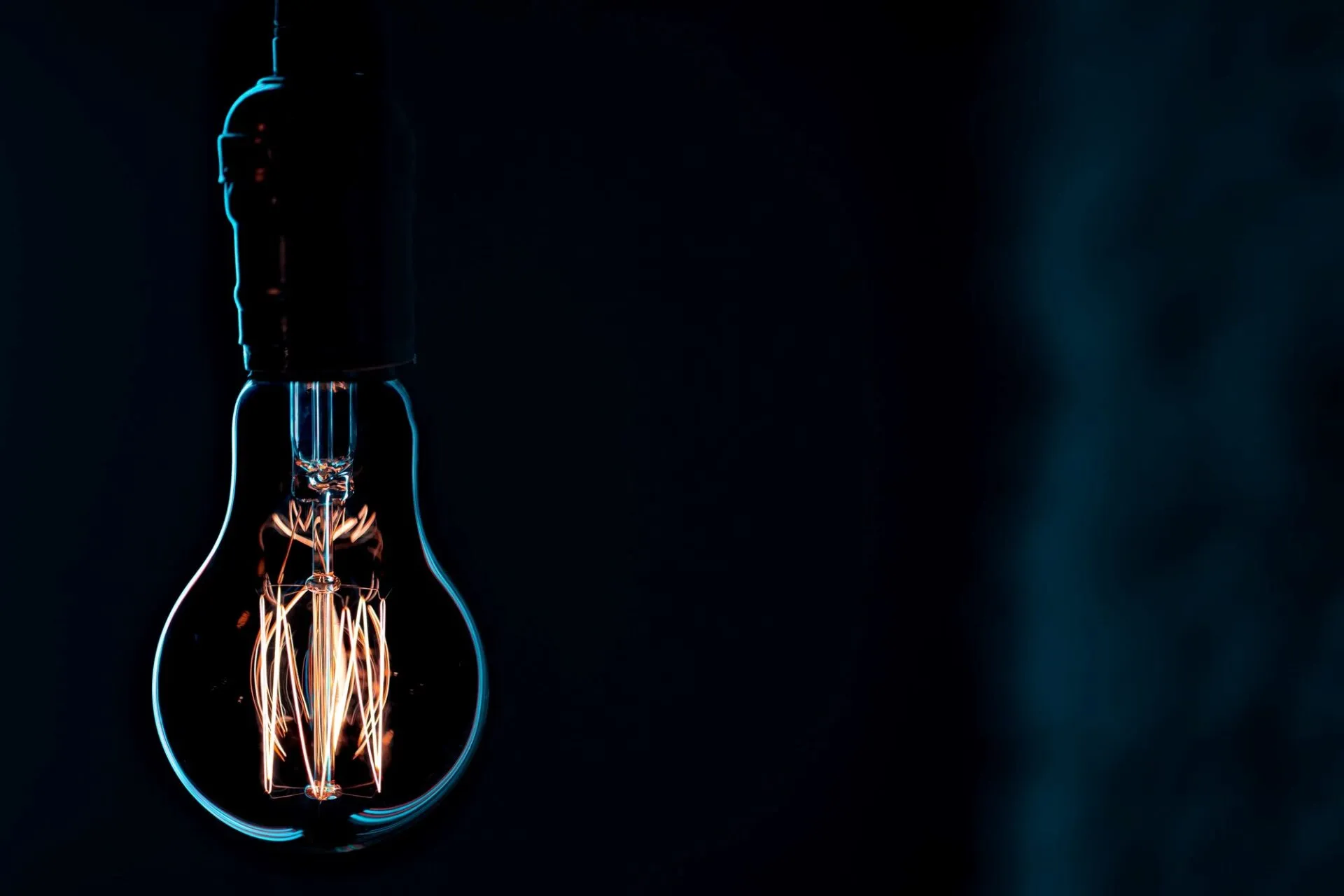 Warm pendant light glowing in the dark